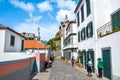 Ribeira Brava, Madeira, Portugal - Sep 9, 2019: Street in the historical center of Madeiran city with Roman Catholic church in the Royalty Free Stock Photo