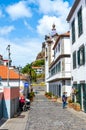 Ribeira Brava, Madeira, Portugal - Sep 9, 2019: Streets in the old town of Madeiran city with Roman Catholic church in the Royalty Free Stock Photo