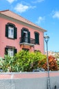 Ribeira Brava, Madeira, Portugal - Sep 9, 2019: Traditional house in Madeiran city. Building with a pink facade and a beautiful