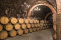 Stacks of wine barrels filled with red wine ageing in the underground tunnels of Ribera del Duero wine region north of Madrid #1