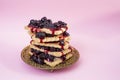 Ribes nigrum,  black currant jam dripping and a stack of rectangular biscuits Royalty Free Stock Photo