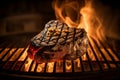 Ribeye steak on a flaming grill. Close-up of a juicy seared piece of meat lying on a grill. In the background the flames of fire.