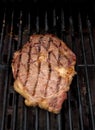 Ribeye Steak grilling on a Barbecue Royalty Free Stock Photo