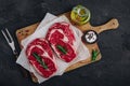 Ribeye Steak, Raw fresh beef meat with salt and rosemary ready for barbecue Royalty Free Stock Photo