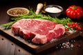 ribeye steak raw with fresh herbs and spices Royalty Free Stock Photo