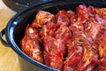 Ribs piled into a black roaster for slow cooking Royalty Free Stock Photo