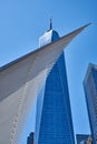 The ribs of the WTC Transportation Hub 2016 pass dramatically in front of One World Trade Center or Freedom Tower 2014 in