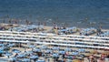 Riccione, Italy. Aerial view of colorful beach umbrellas, gazebos and sun beds. Summer holidays at the sea Royalty Free Stock Photo