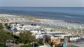 Riccione, Italy. Aerial view of colorful beach umbrellas, gazebos and sun beds. Summer holidays at the sea Royalty Free Stock Photo