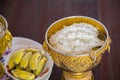 Rice in ancient bowl for offering alms to the monks