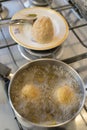 Rice balls frying in boiling oil Royalty Free Stock Photo