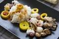 Rice, bamboo and seafood on black plate Royalty Free Stock Photo