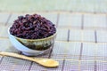 Rice berry in bowl with wooden spoon