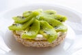 Rice biscuit with cheese and kiwi.