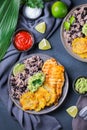 Rice with black beans, fried chicken breast and tostones, plantains Royalty Free Stock Photo