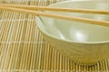 Rice bowl on bamboo mat with chopsticks Royalty Free Stock Photo