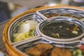 rice bowl with rattan, inside is traditional Vietnamese lunch, rice, soup, salty food. The scene is frugal and peaceful Royalty Free Stock Photo