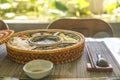 rice bowl with rattan, inside is traditional Vietnamese lunch, rice, soup, salty food. The scene is frugal and peaceful Royalty Free Stock Photo