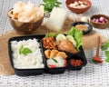 Rice Box, Nasi Berkat, Indonesian Nasi Kotak with Soy Sauce Chicken, Oreg Tempeh, and Spicy Paste Royalty Free Stock Photo