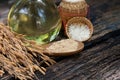 Rice bran , ear of rices and oil on nature background Royalty Free Stock Photo