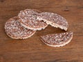 Rice cakes, crackers with milk chocolate and coconut on naturalwood board. Healthy crunchy treat.