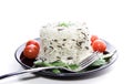 Rice with cherry tomatoes and greens on a black plate Royalty Free Stock Photo