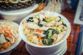 Rice with chicken, seafood and vegetables. Night food market, Thailand.