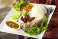 Rice, chili sauce, fish and pork fried with vegetables on a whit Royalty Free Stock Photo