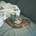 Rice coconut porridge and espresso in bed, square crop Royalty Free Stock Photo