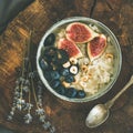 Rice coconut porridge with figs, berries and hazelnuts, square crop Royalty Free Stock Photo