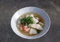 Rice congee mixed with Shrimp, fish, squid and pork, Garnish with coriander. Royalty Free Stock Photo