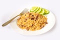 Rice cooked with meat, vegetables and spices. Uzbek traditional dish plovin a white plate on an  background Royalty Free Stock Photo