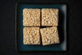 Rice Crispy Treats On Black Matte Plate. Generative AI Royalty Free Stock Photo