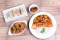 Rice with deep fried dolly fish in japanese yellow curry served with side dish of stuffing flour and onion ring on wood. Royalty Free Stock Photo