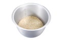 Rice in electric rice cooker pot with scales isolated on white background. Rice with scales in electric rice cooker pot isolated Royalty Free Stock Photo