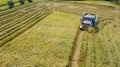 Rice farm on harvesting season by farmer with combine harvesters