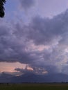 Rice fields and mountains in the evening with dark clouds Royalty Free Stock Photo