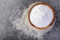 Rice flour in wooden bowl on gray background. Royalty Free Stock Photo