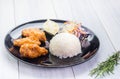 Rice,fried chicken wing and salad on tablecloth on white wood table in kitchen,food menu meal Royalty Free Stock Photo