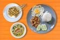 rice with fried pork with garlic, fried egg and Thai green curry Royalty Free Stock Photo