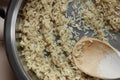 Rice frying and oiling in ghee on steel pan closeup, process of cooking asian indian basmati ghee rice