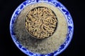 Rice grains in a bowl on white rice texture background. Macro background of rice grains. Basmati rice on a pile isolated on black Royalty Free Stock Photo