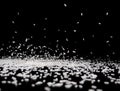 Rice grains fall on a black surface on a black background Royalty Free Stock Photo