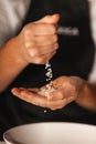 Rice grains fall from one hand to another Royalty Free Stock Photo