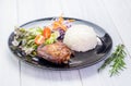 Rice,grilled chicken breast and salad on tablecloth on white wood table in kitchen,food menu meal