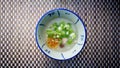 Rice gruel or boiled rice in Thailand tradition style on mat background and have some space for write wording