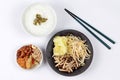 Rice gruel and fried mixed vegetable served side dish.