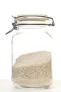 Rice in jar on white background