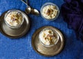 Rice Khir or kheer or payesh or payasam or rice pudding served in vintage silver plate.Table top view