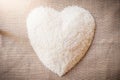 Rice laid out in a heart shape on sackcloth